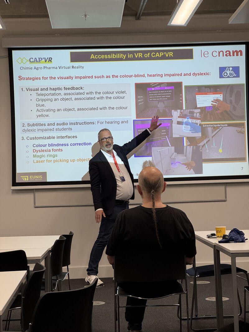 Christian Cousquer speaking at a conference